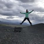 A photograph of Donna Giraud jumping for joy.